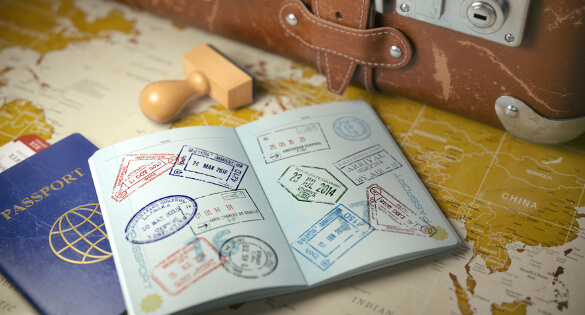 Travel or turism concept.  Old  suitcase  with opened passport with visa stamps. 3d illustration